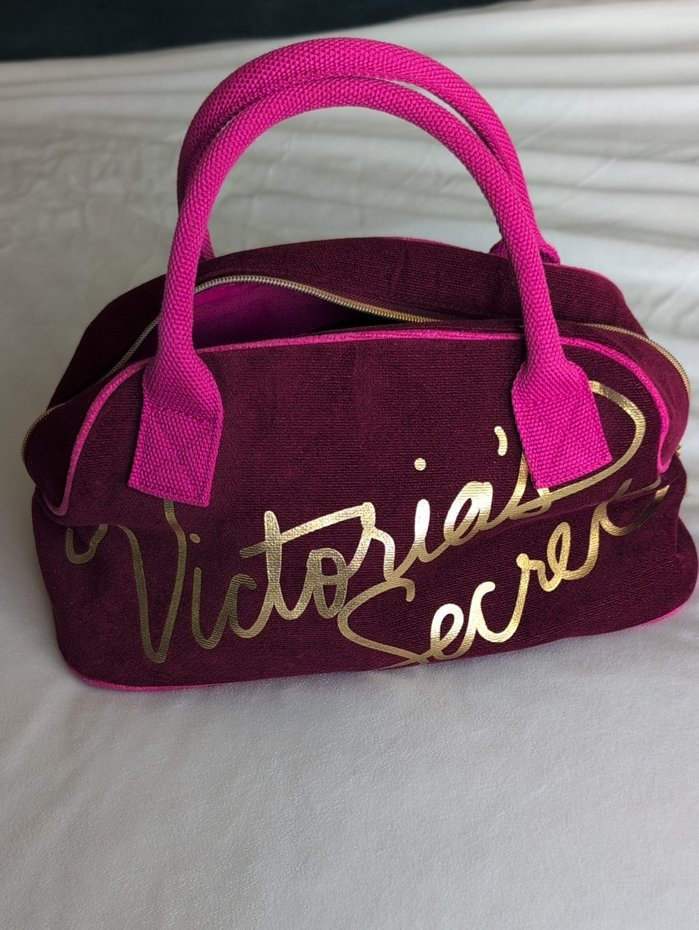 vintage Victoria's Secret maroon and hot pink vanity bag from the Y2K era